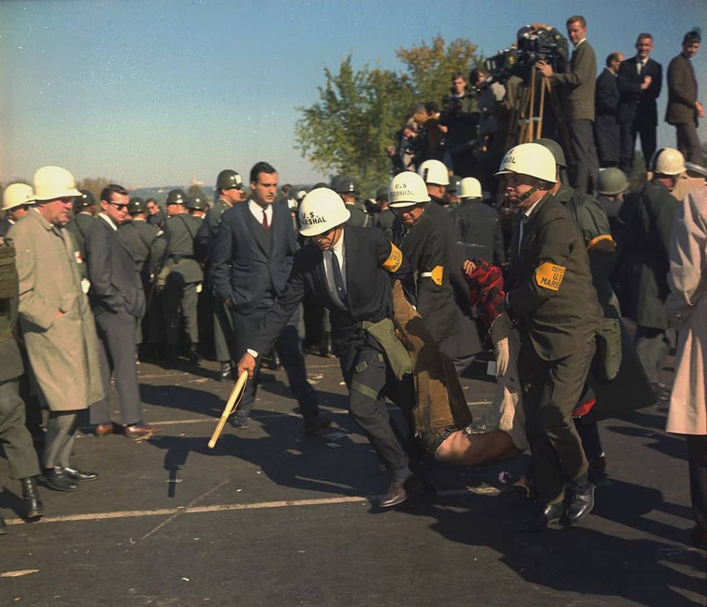 U.S. Marshals removing one of the protesters during the outbreak of violence at the Pentagon building during the Vietnam War Protests (1967)