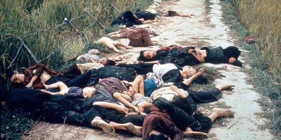 Photo taken by United States Army photographer Ronald L. Haeberle on March 16, 1968 in the aftermath of the My Lai massacre showing mostly women and children dead on a road (1968)