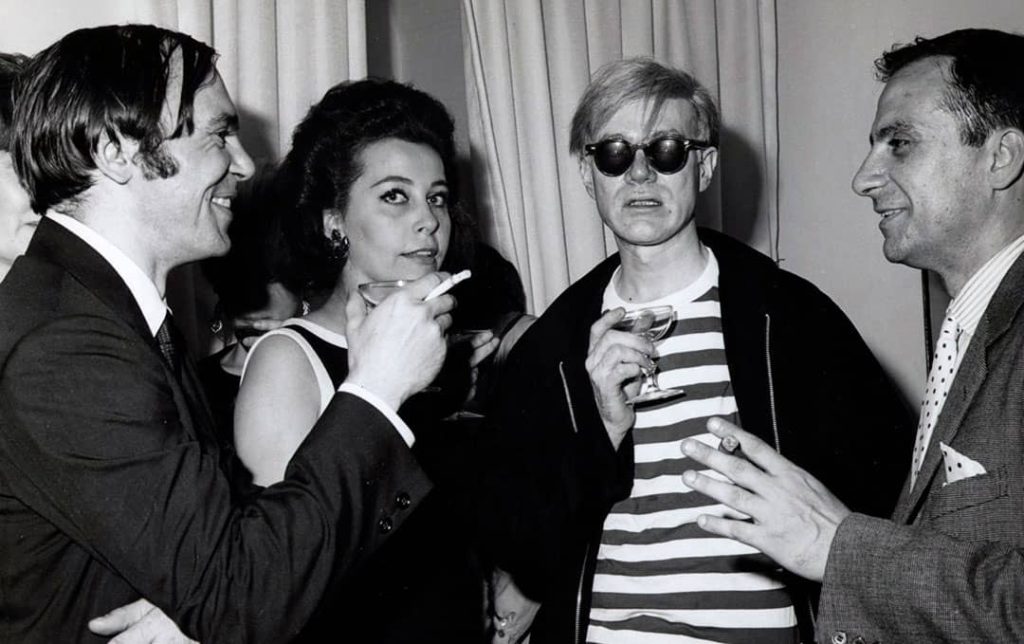 Picture from the Bianchini gallery opening party, depicted from left to right: Bob Stanley, Ultra Violet, Andy Warhol, and Paul Bianchini (1965)