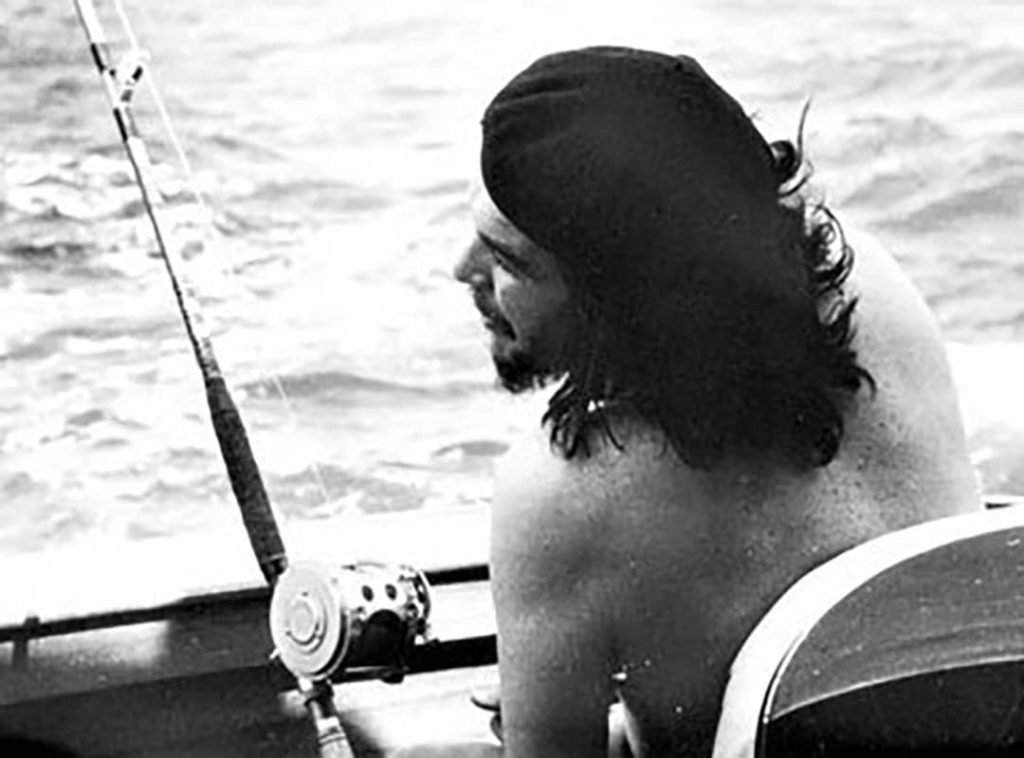 Photograph of Ernesto 'Che' Guevara, along with boat mate Fidel Castro (not pictured), competed against acclaimed author Ernest Hemingway at the 'Hemingway Fishing Contest' in Havana, Cuba (1960)