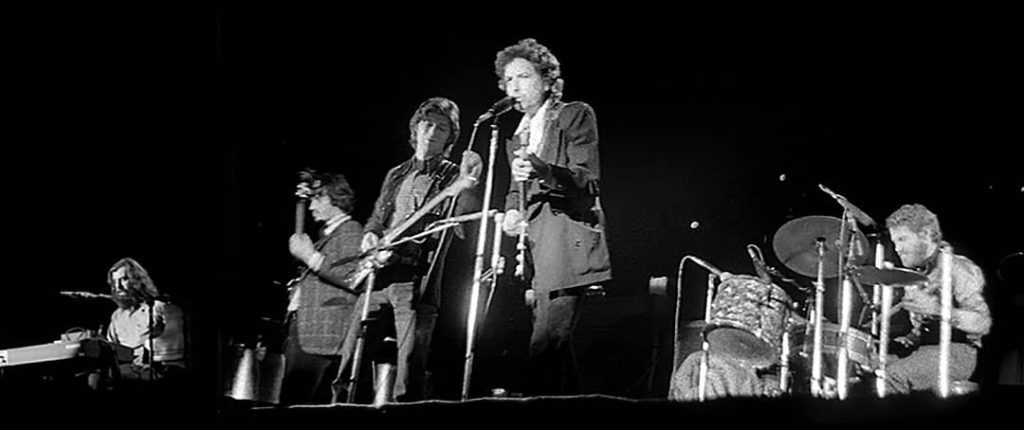 Picture of Bob Dylan and The Band performing (1974)