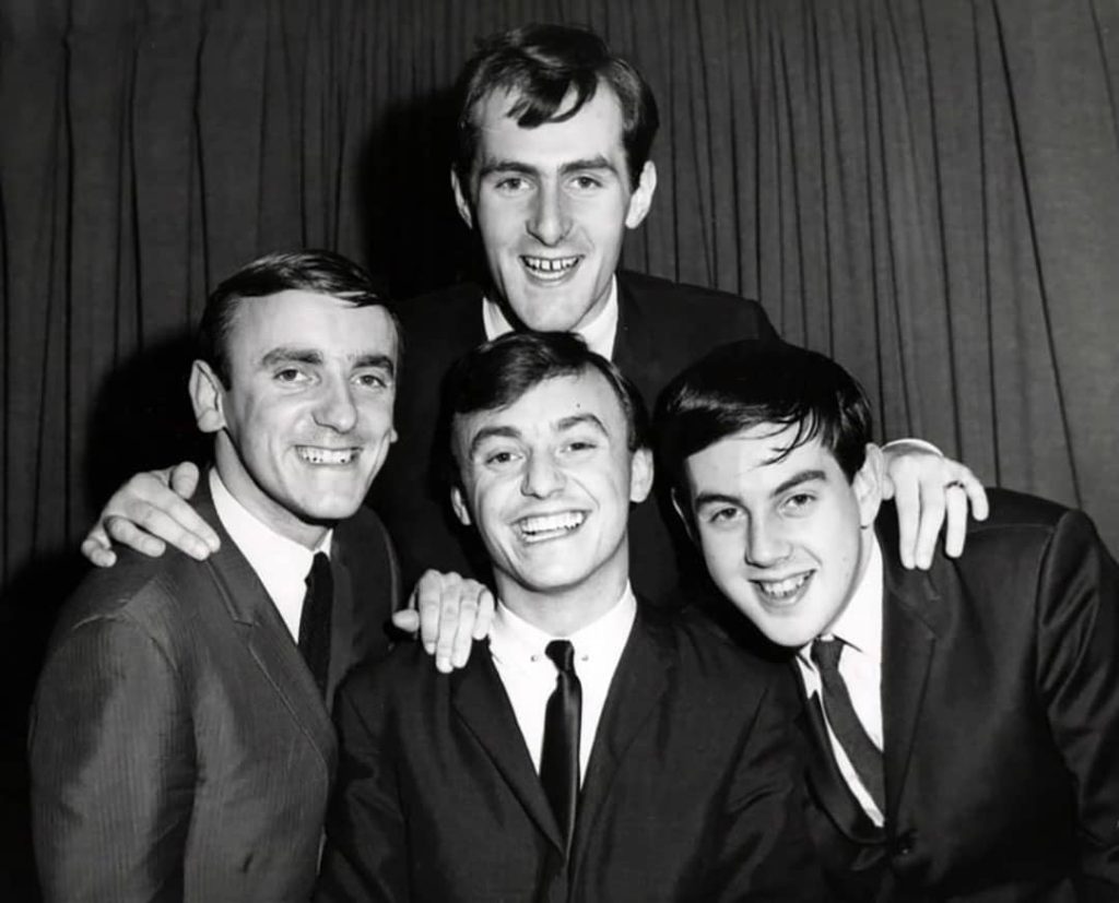 Photo of Gerry and the Pacemakers musical group taken during their first trip to the United States, likely to appear on 'The Ed Sullivan Show'. From left to right: Les Maguire (top), Freddie Marsden, Gerry Marsden, and Les Chadwick (1964)