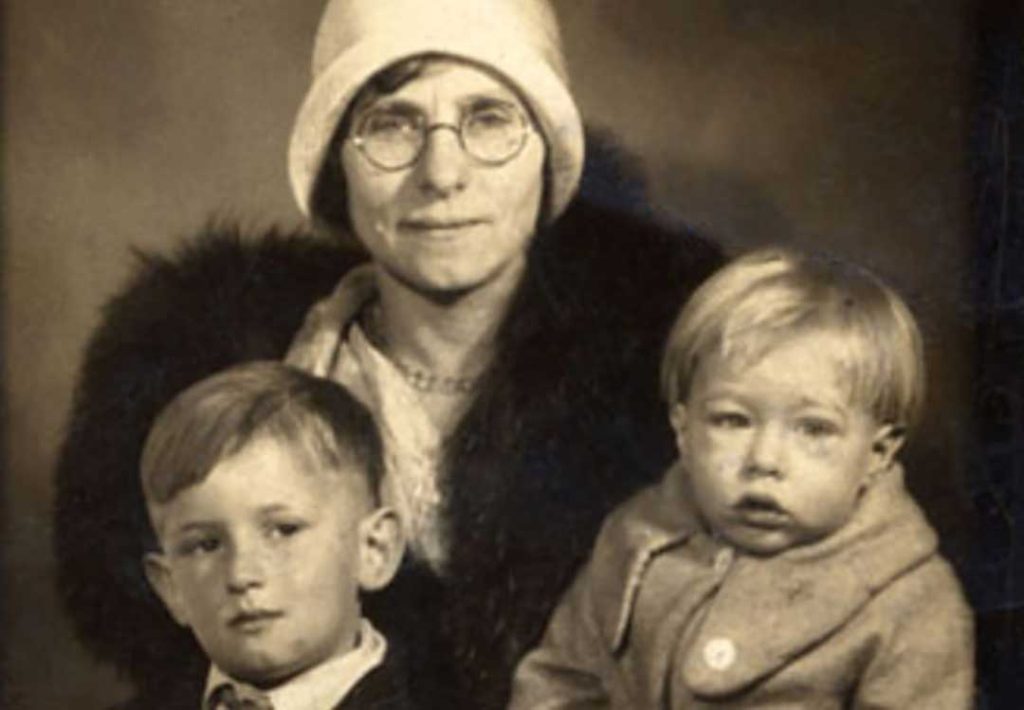 Old photograph of Julia Warhola (centre) with an infant Andy Warhol (right) and his brother, John (left) (circa 1929)
