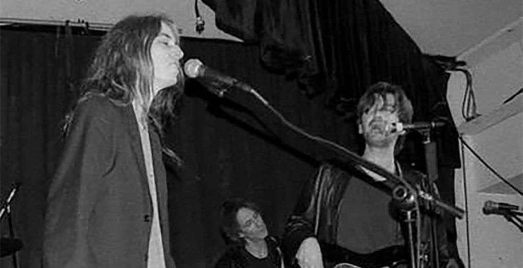 Patti Smith and her band performing at the Winter Solstice concert at the 'Be Here Now' club in Asheville, North Carolina, USA (1997)