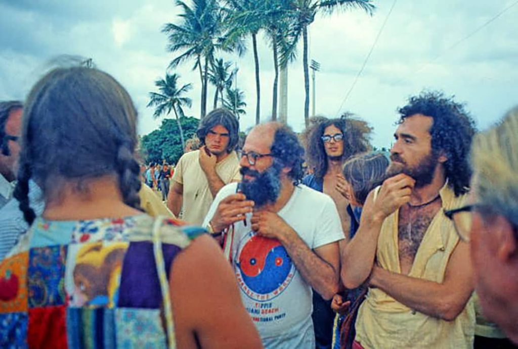 Allen Ginsberg conversing with the protestors at the Vietnam anti-war protest on Miami Beach, Florida (1972)