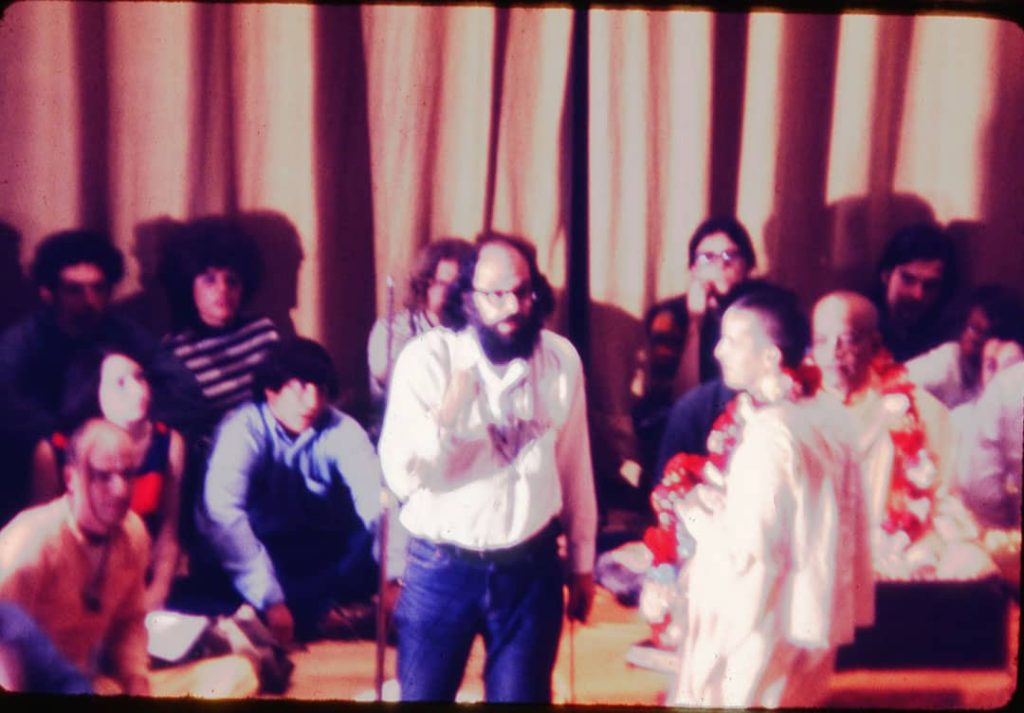 Photograph Allen Ginsberg (centre) at the presentation by the Swami Bhaktivedanta to support the OSU Yoga Society and local Hare Krishna held in Hitchcock Hall Auditorium, Columbus, Ohio, USA (1969)